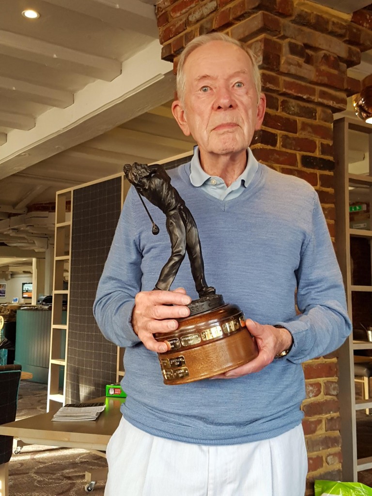 Jim holds the Mike Maloney Trophy 2018